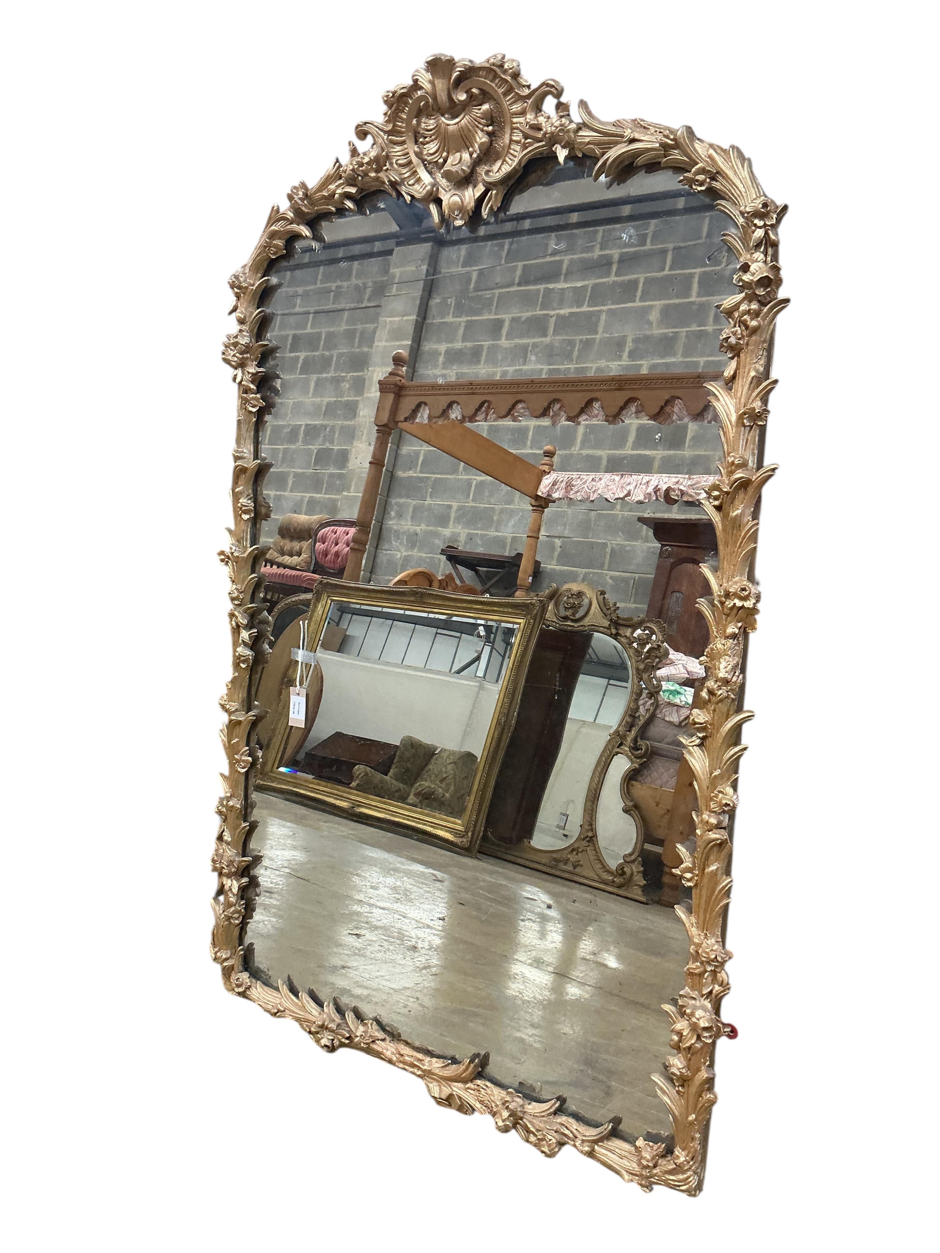 A Victorian carved giltwood and composition overmantel mirror, with later painted decoration, width 104cm, height 161cm